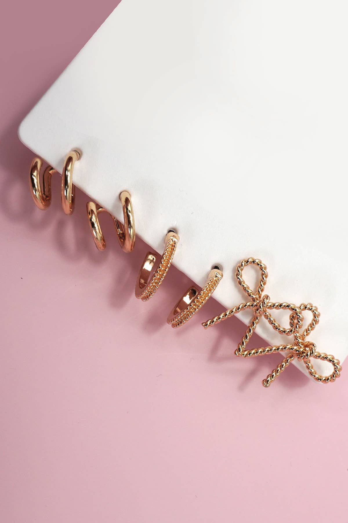 TRIO HUGGIE BOW HOOP TITANIUM POST EARRINGS | 80E06205: Gold JOSSLYN by wall to wall 