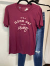 It&#39;s A Good Day to Be Merry Maroon Graphic Tee Short sleeve Storied Folk 